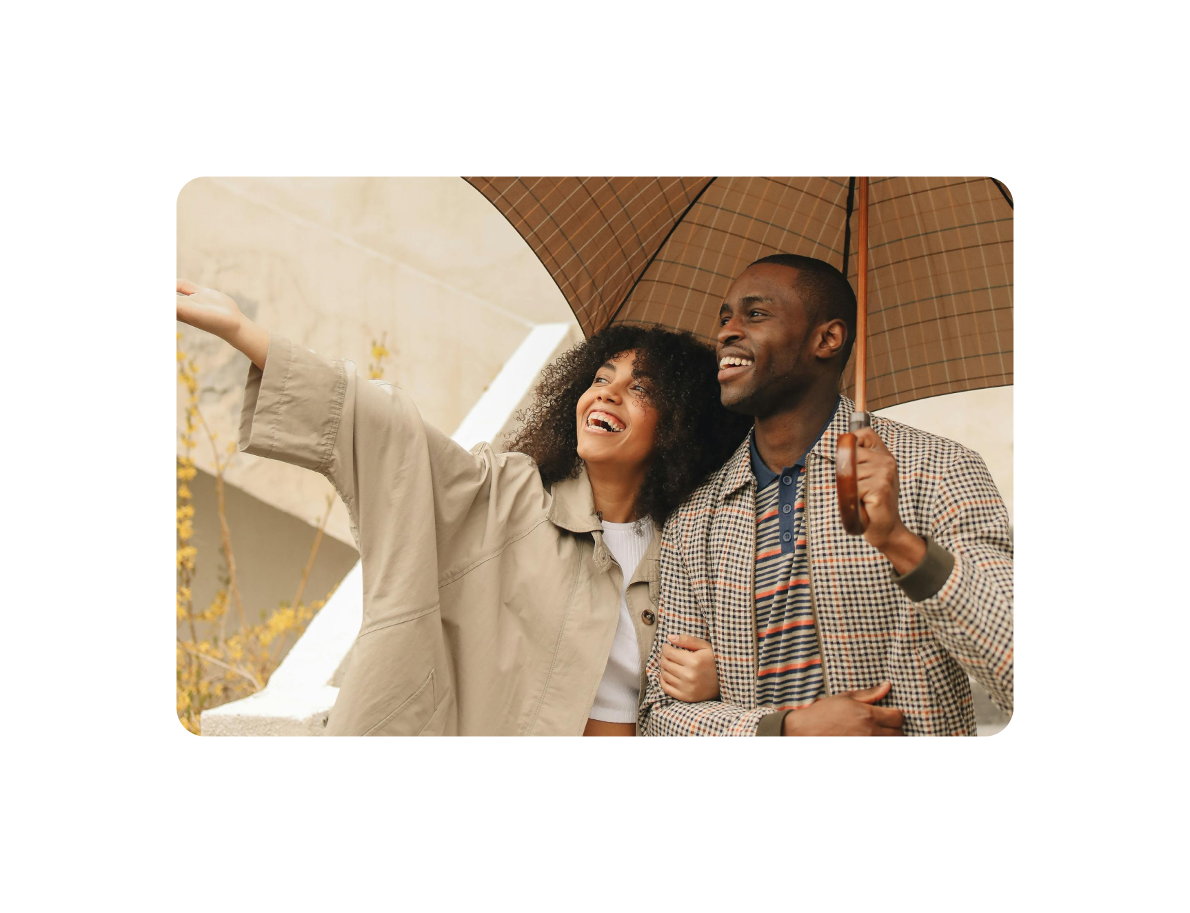 Happy tenants under umbrella